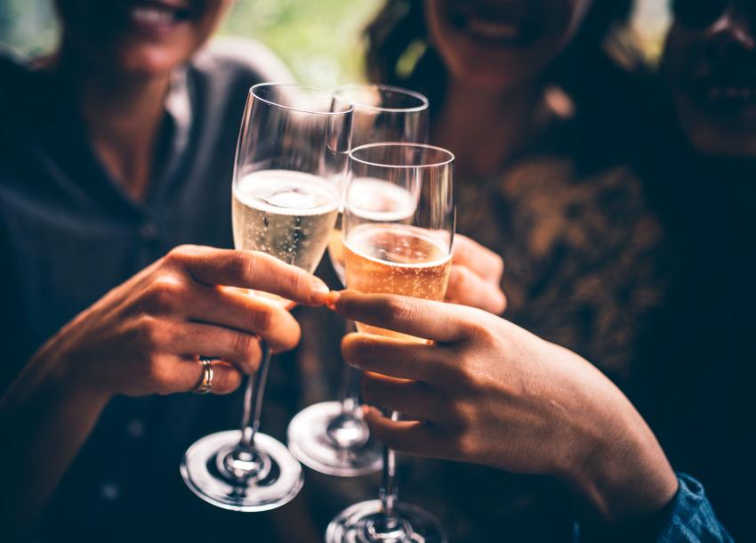 3 friends toasting new year with Devon sparkling wine